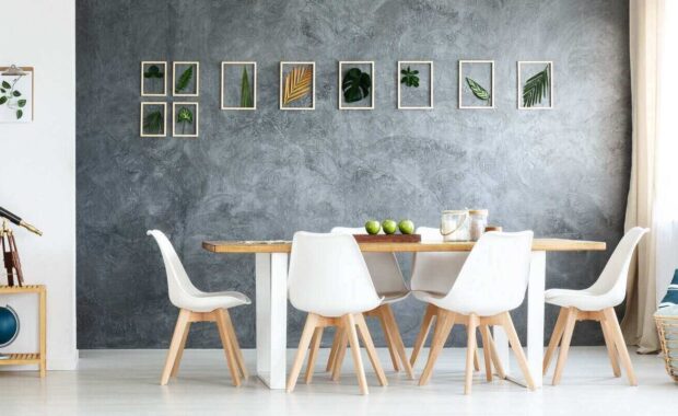 sofa and telescope on wood shelf in spacious living room with dining table