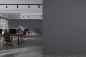 gray open space office with blank wall
