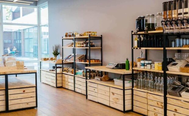 wooden shelves with different food goods and personal hygiene with tan digital wall coverings