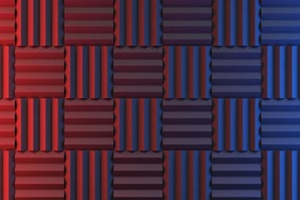 wall of acoustic foam panels illuminated by red and blue lights